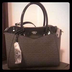 Black and grey Guess purse new with tags.